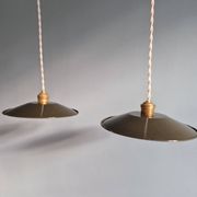 Pair of industrial pendant lights in olive green enameled sheet metal