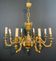 Important bronze chiseled chandelier in Louis XVI style with 8 light arms by Lucien Gau.