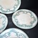 Onnaing Faïencerie set of 4 Coppelia plates with green floral decoration, iron earthenware