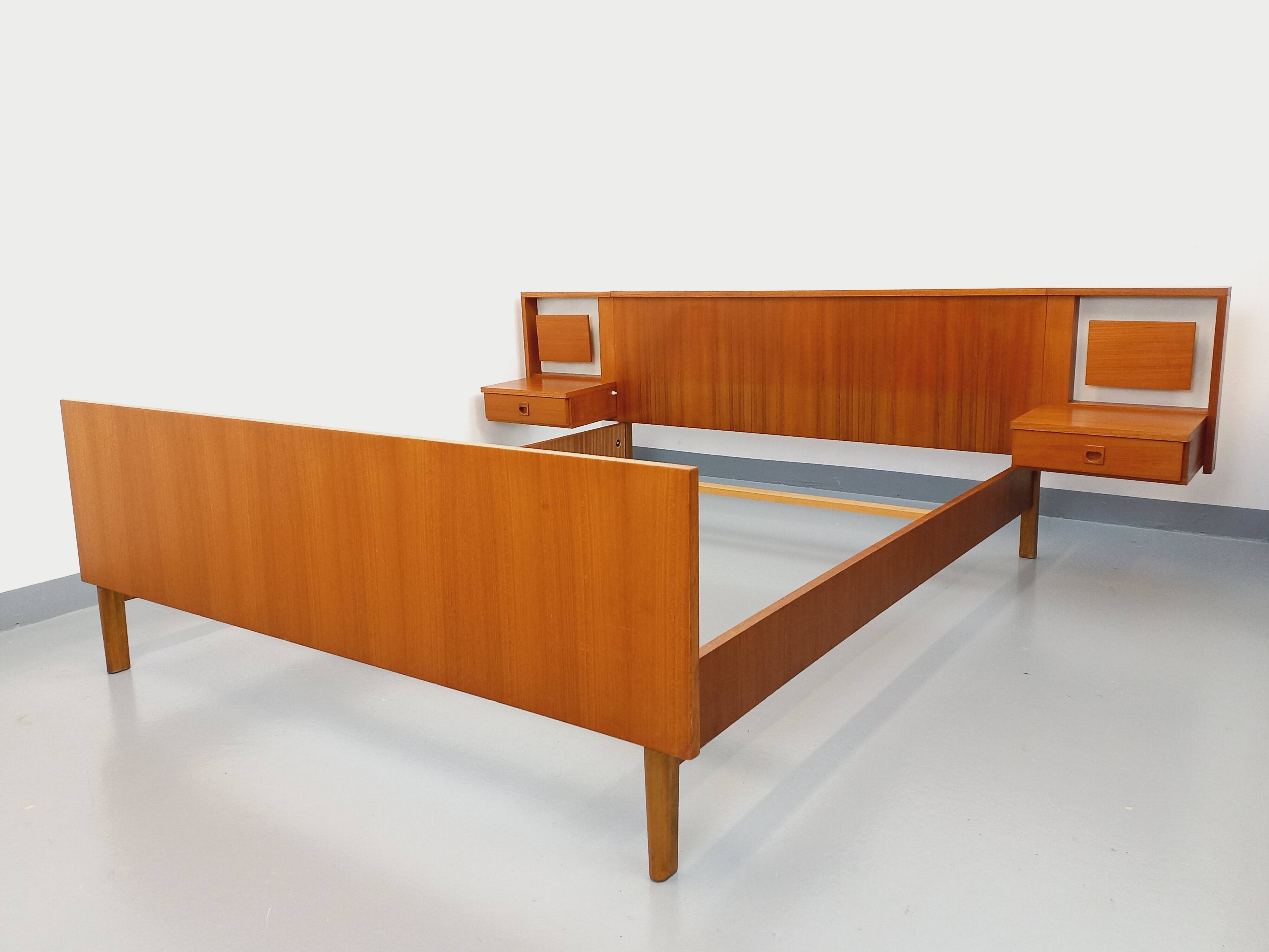 Vintage Scandinavian style double bed in teak from the 60s with integrated bedside lights