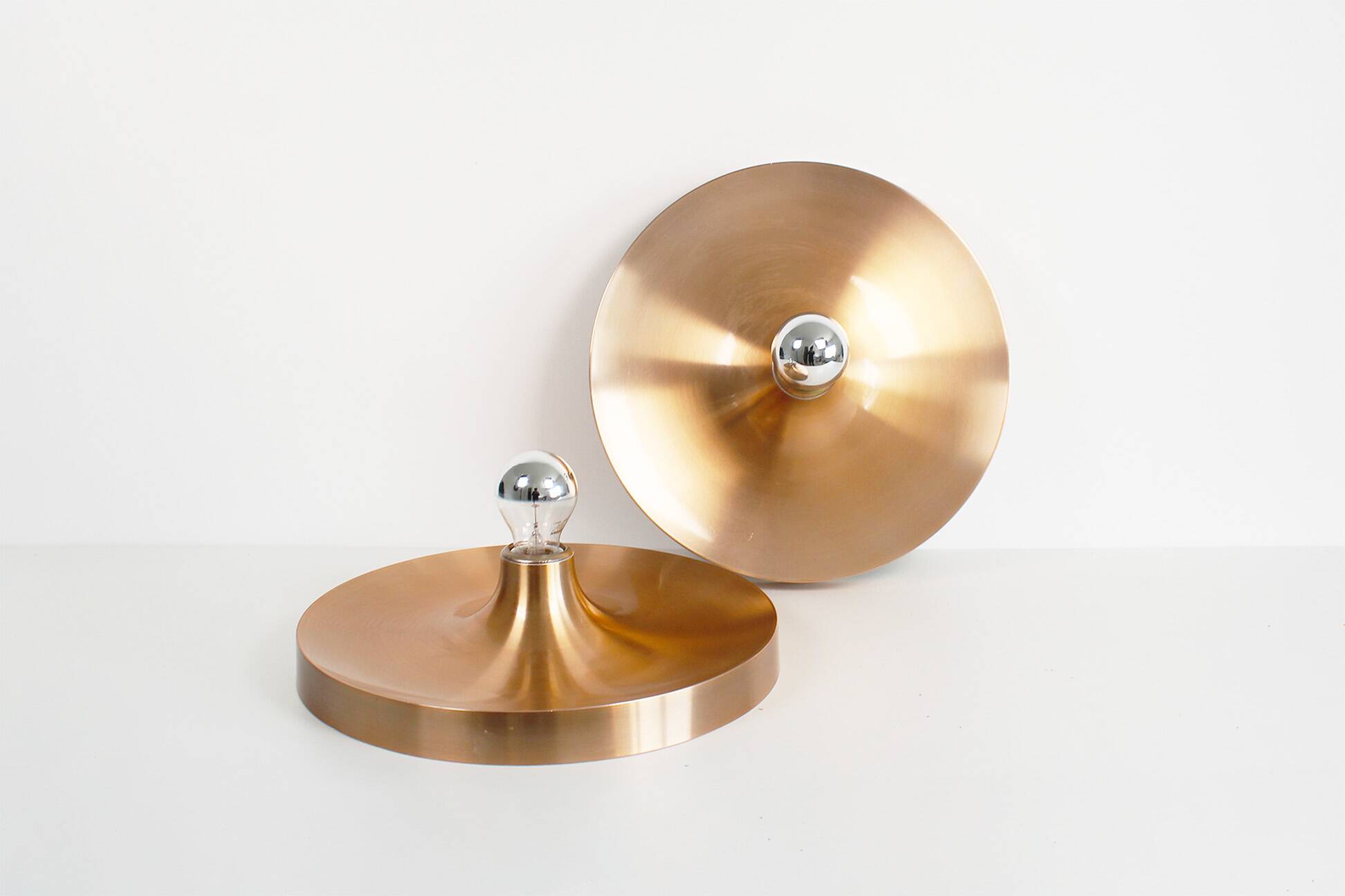Pair of medium sized (35cm) rose gold Honsel Disc sconces selected by Charl