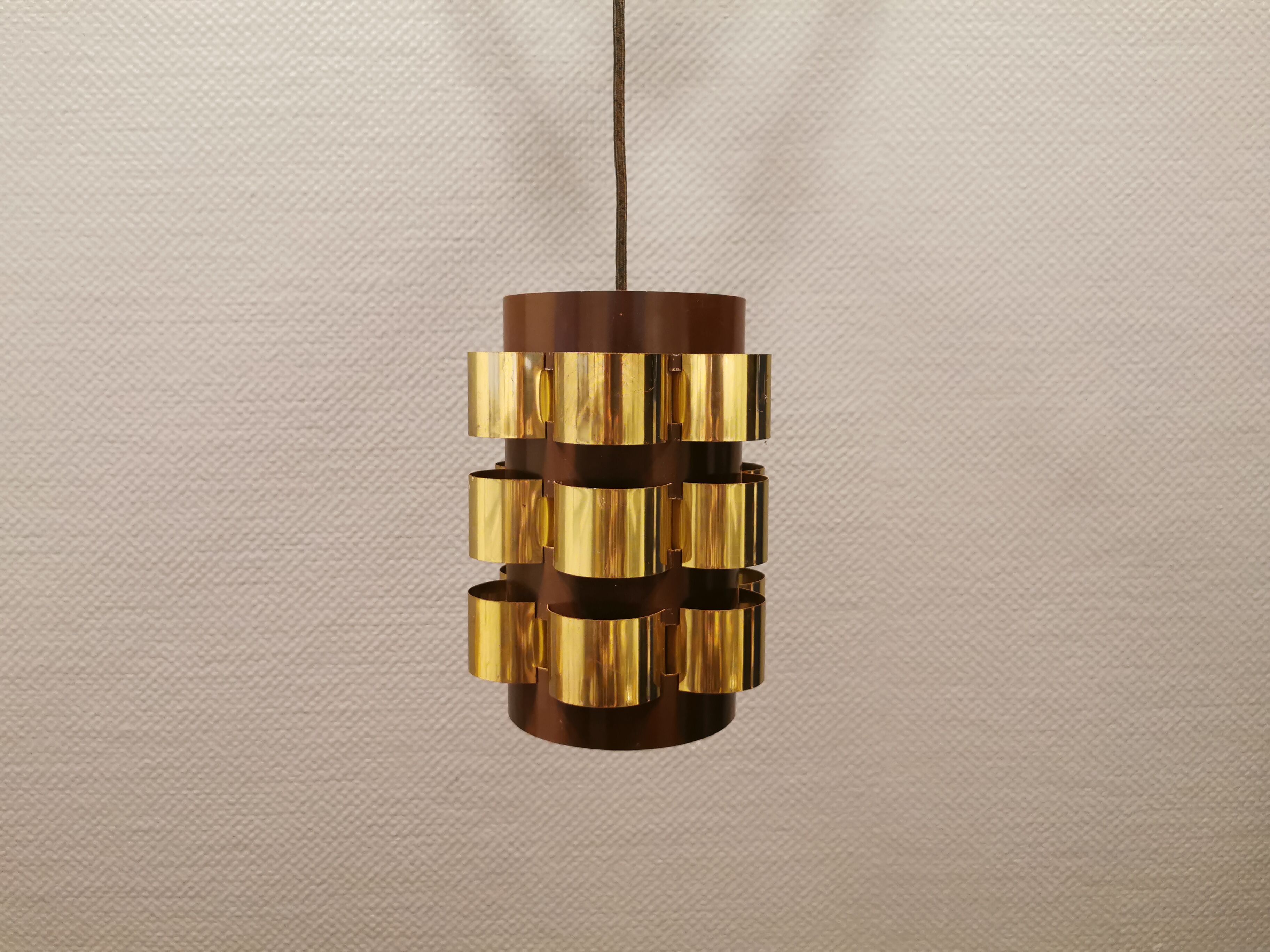 Danish hanging lamp from the 70s, in thin cut metal.