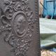 Black cast iron wood burning stove with solid brass handle.