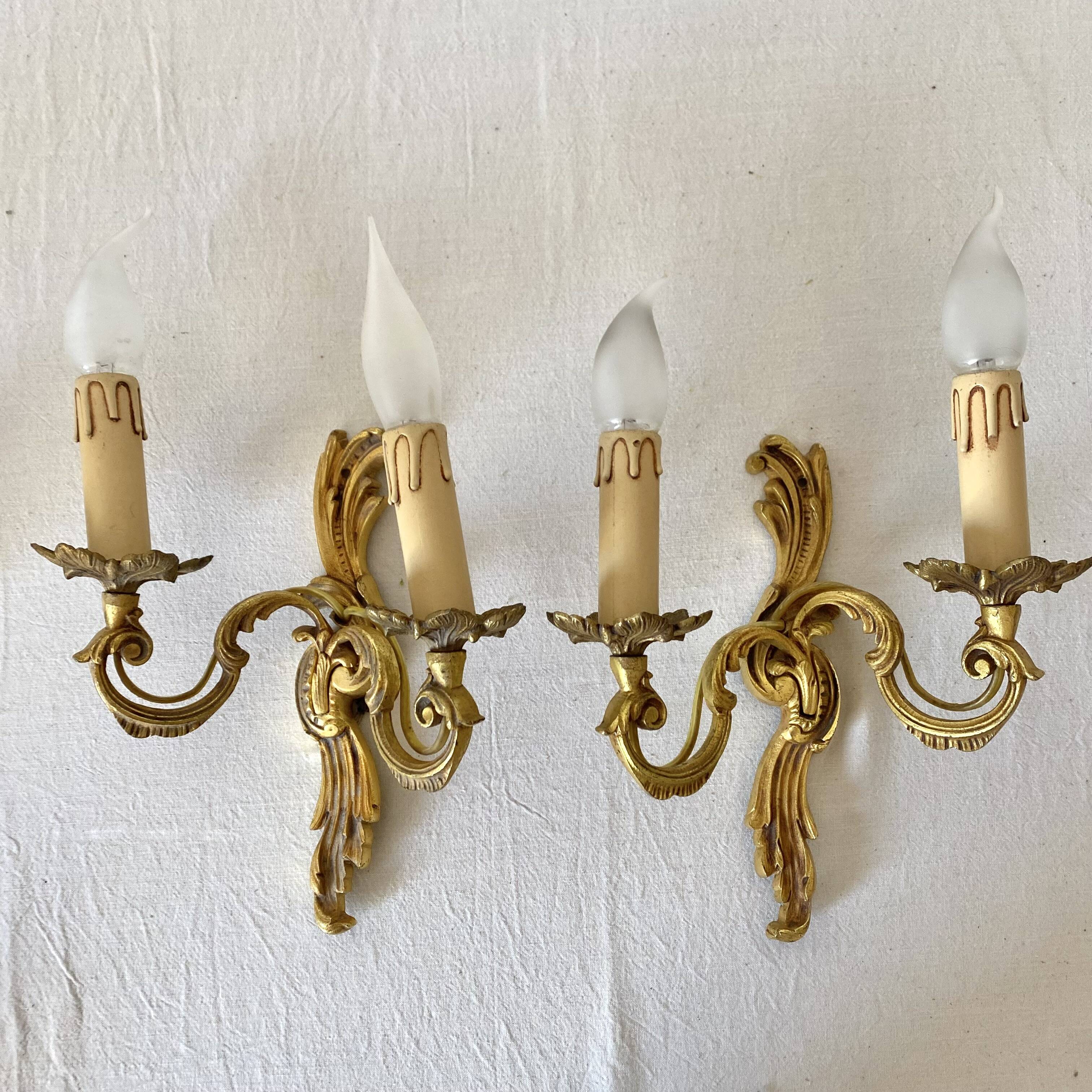 Pair of golden rococo-style wall lights