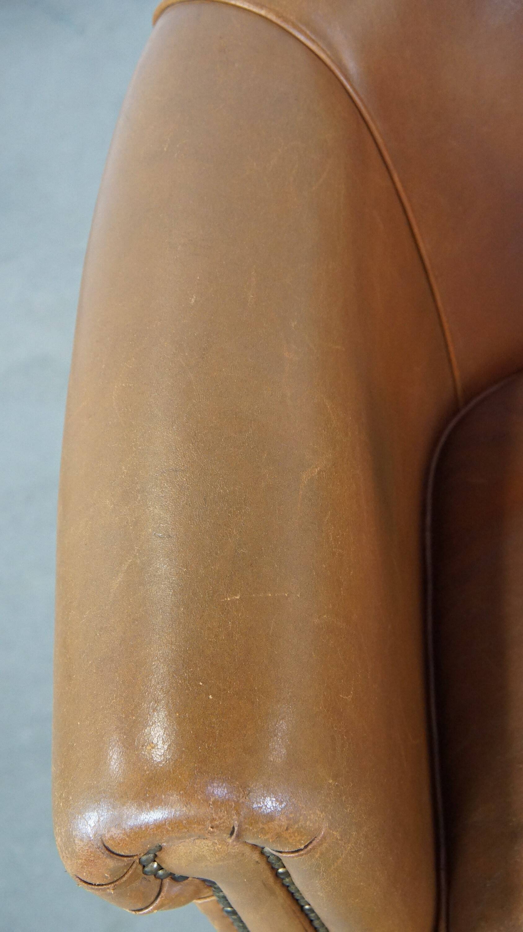 Sheep leather club chair in neutral cognac colour and in good condition