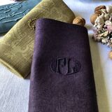 Suite of four tinted antique napkins