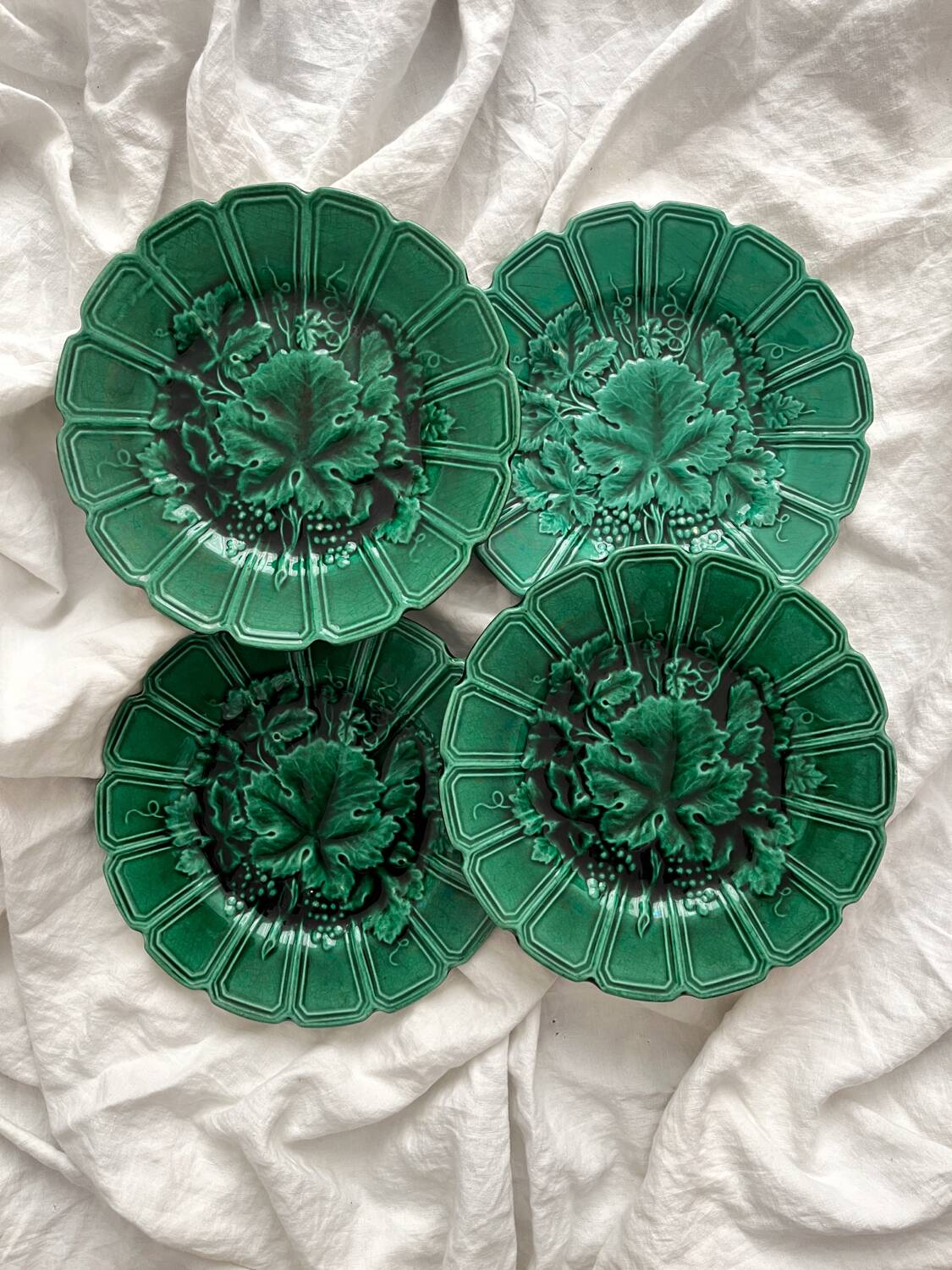 4 old plates in Sarreguemines vine leaf slip
