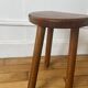 Tabouret tripode demi-lune