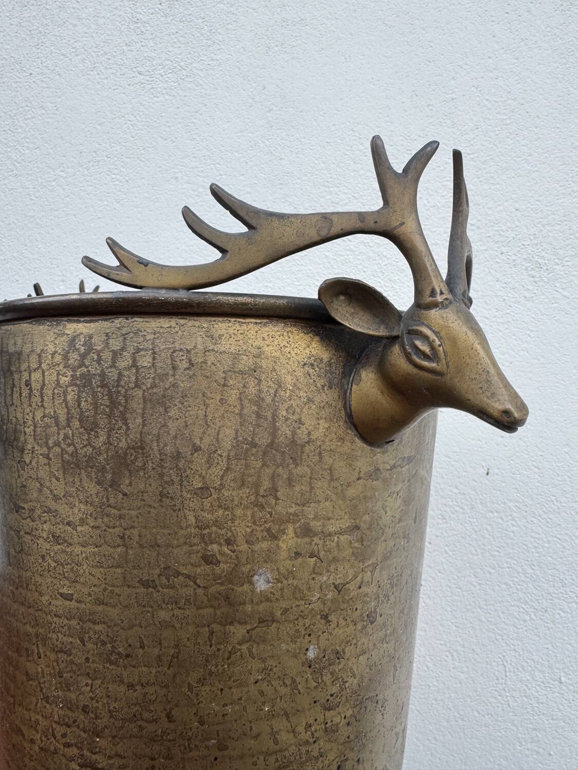 Antique champagne cooler with stag heads