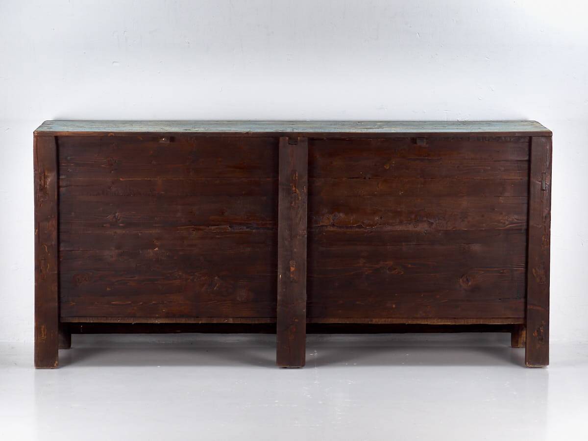 Old wooden entrance buffet in blue and yellow tones (circa 1920).