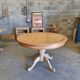 Round cherry table with 2 extensions.