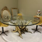 Round glass and brass table by designers Richard and Isabelle Faure