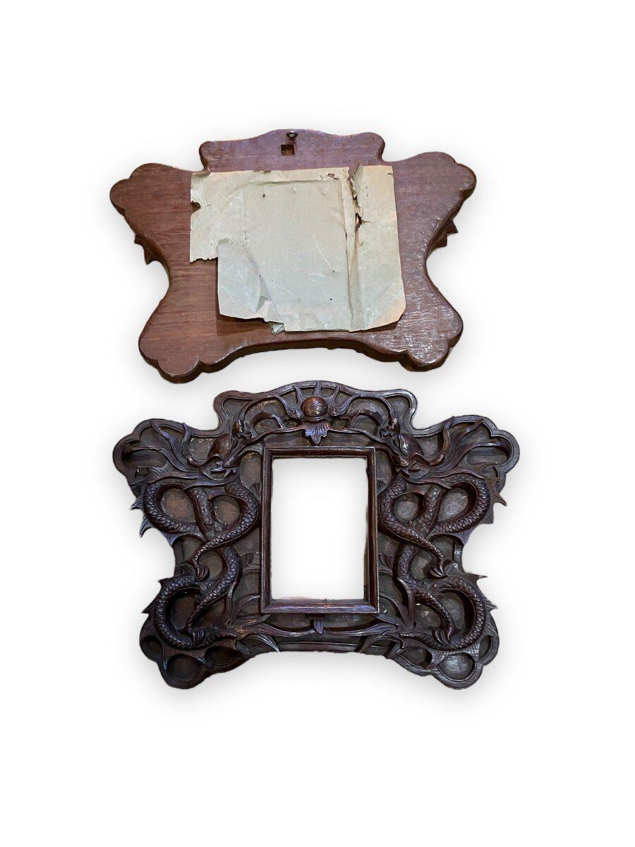 Pair of exotic wooden frames with dragons