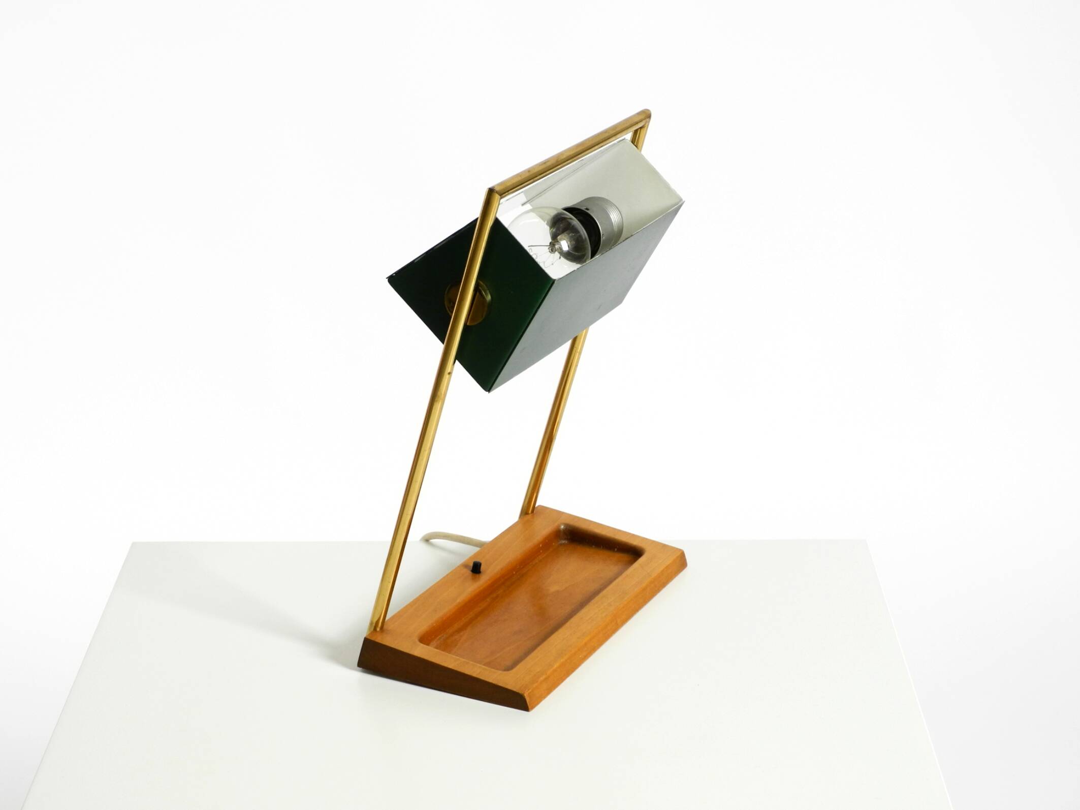 1960s Temde table lamp with a brass frame, teak base, and green lampshade