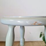 Antique tripod stool made of solid wood in blue.