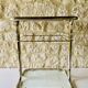 Glass and brass side table with magazine rack, circa 1970's
