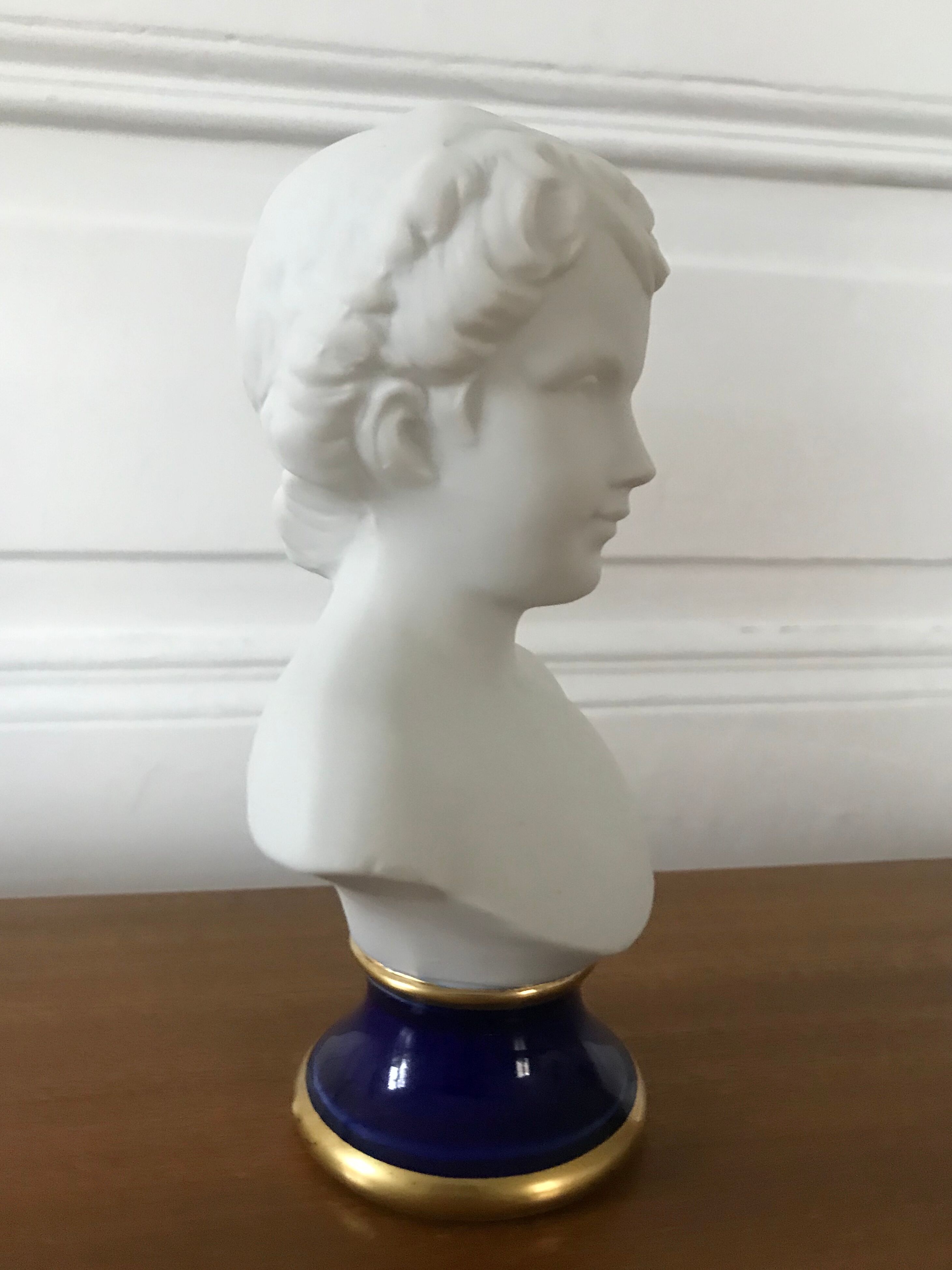 Ancient statuette bust in biscuit