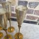 Lot of 11 brass champagne flutes