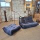 Togo sofa by Ligne Roset and its pouf from the 1970s.