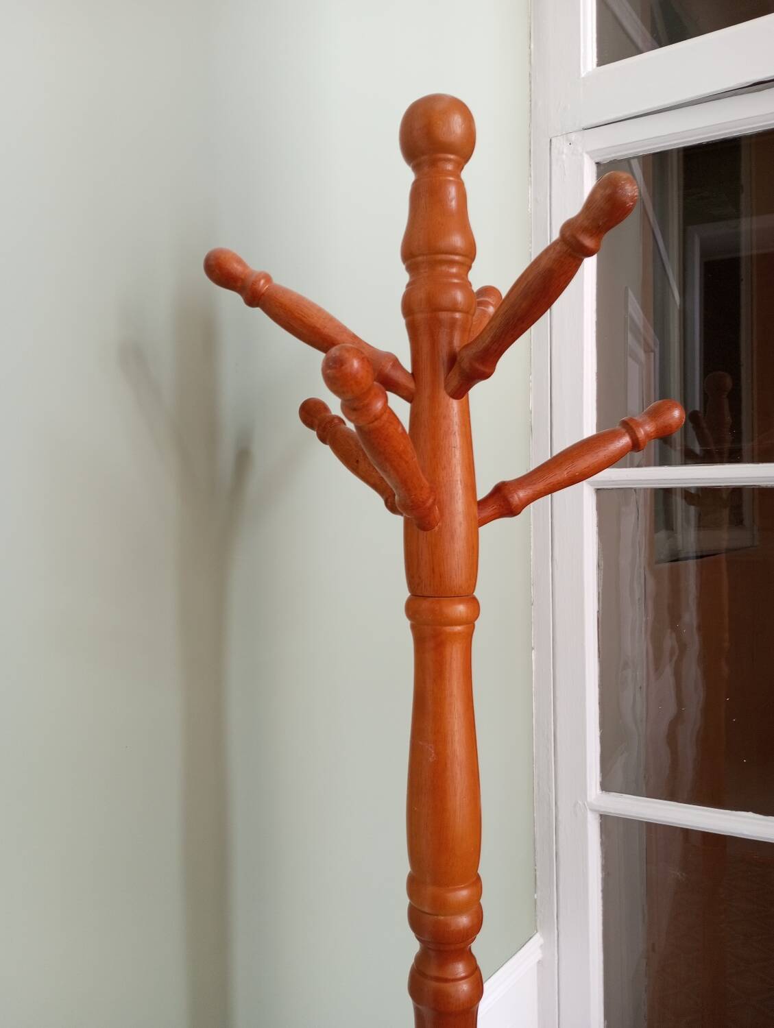 Wooden coat rack on stand