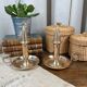Duo of brass cellar rat candlesticks with extinguisher