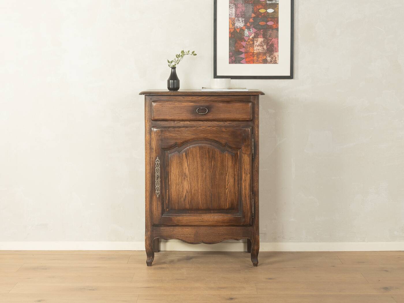 Antique chest of drawers with curved silhouette and patina