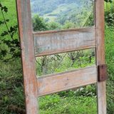 Mirror (3 panels) on door.