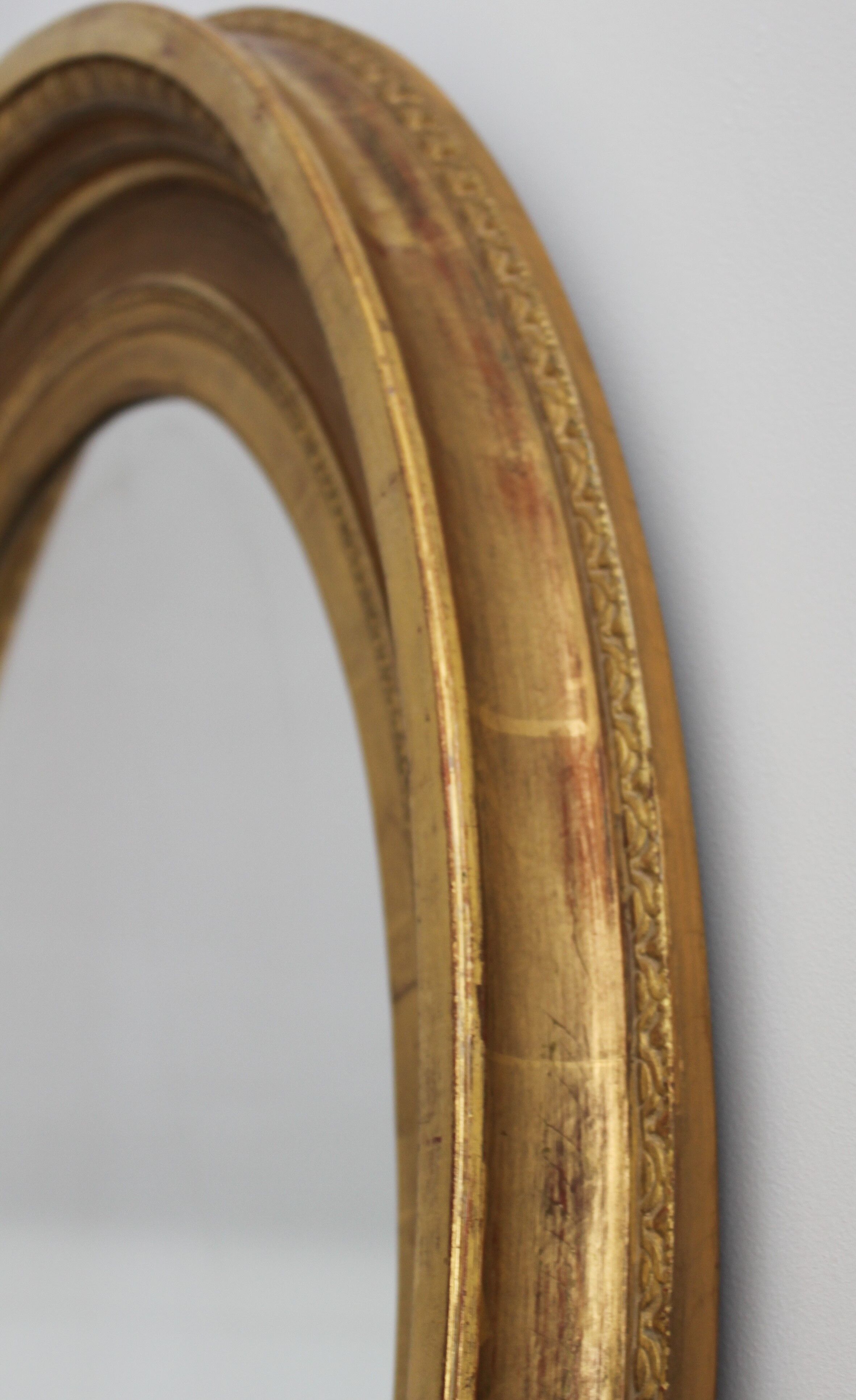 Mirror antique medallion gilded with gold leaf