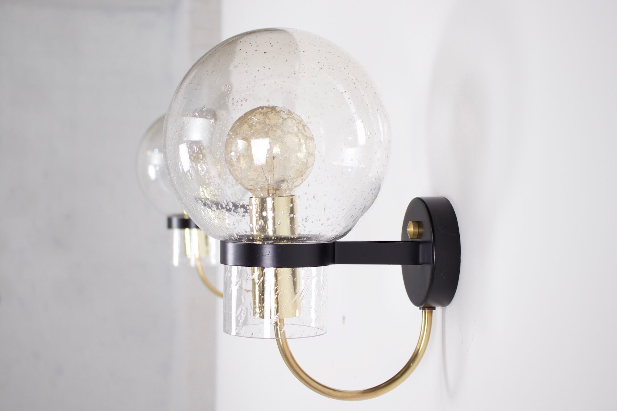 Wall lights with blown glass globes.