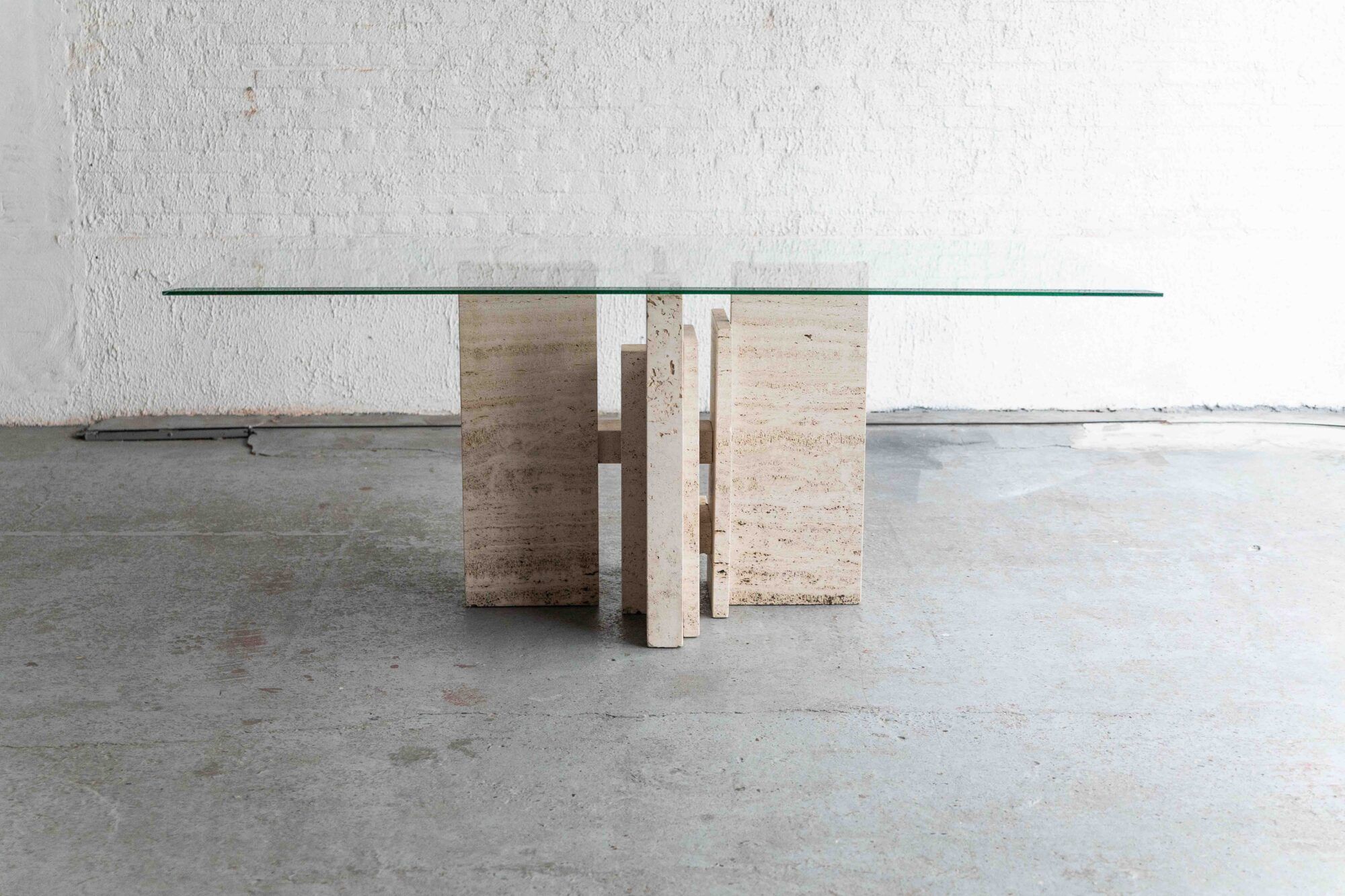 Glass & travertine dining table by Willy Ballez