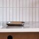 Minimalist stainless steel pocket emptier