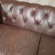Three seater brown leather chesterfield sofa