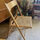 Pair of folding wooden chairs and vintage cannage