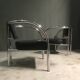 A pair of petite low armchairs by ronald cecil sportes for lumen center, 1987