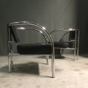 A pair of petite low armchairs by ronald cecil sportes for lumen center, 1987