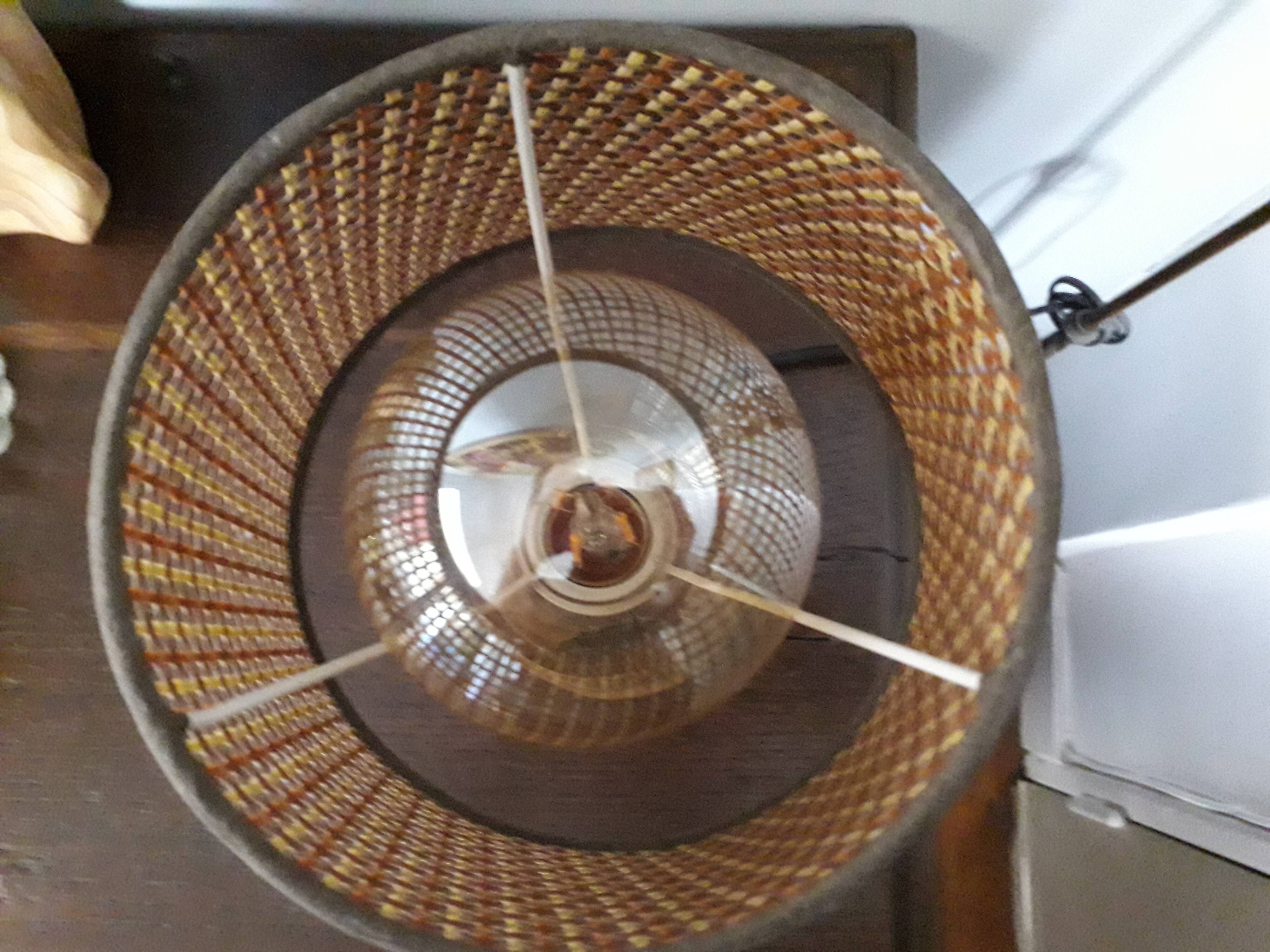 Vintage metal lamp with its caned lampshade