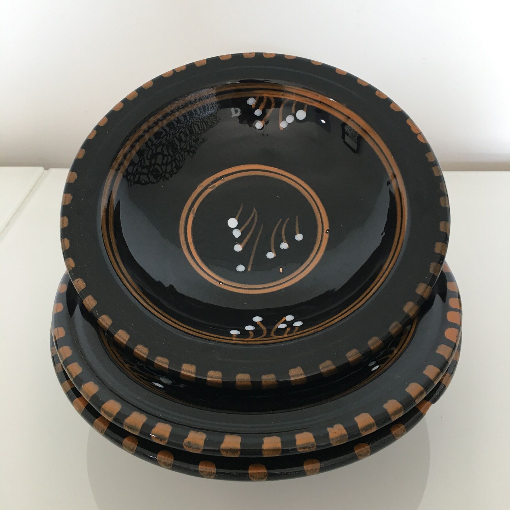Set of 3 black decorative deep plates.