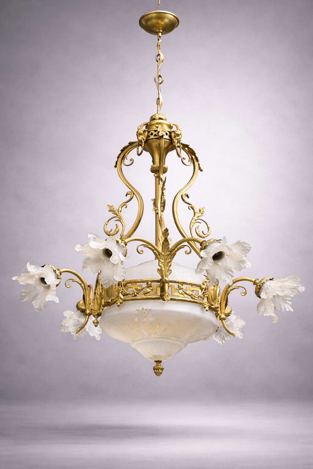 Chandelier with ram's heads. Louis XVI. Gilded bronze. Crystal.