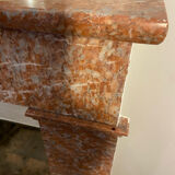 Marble fireplace surround with closed hearth frame.