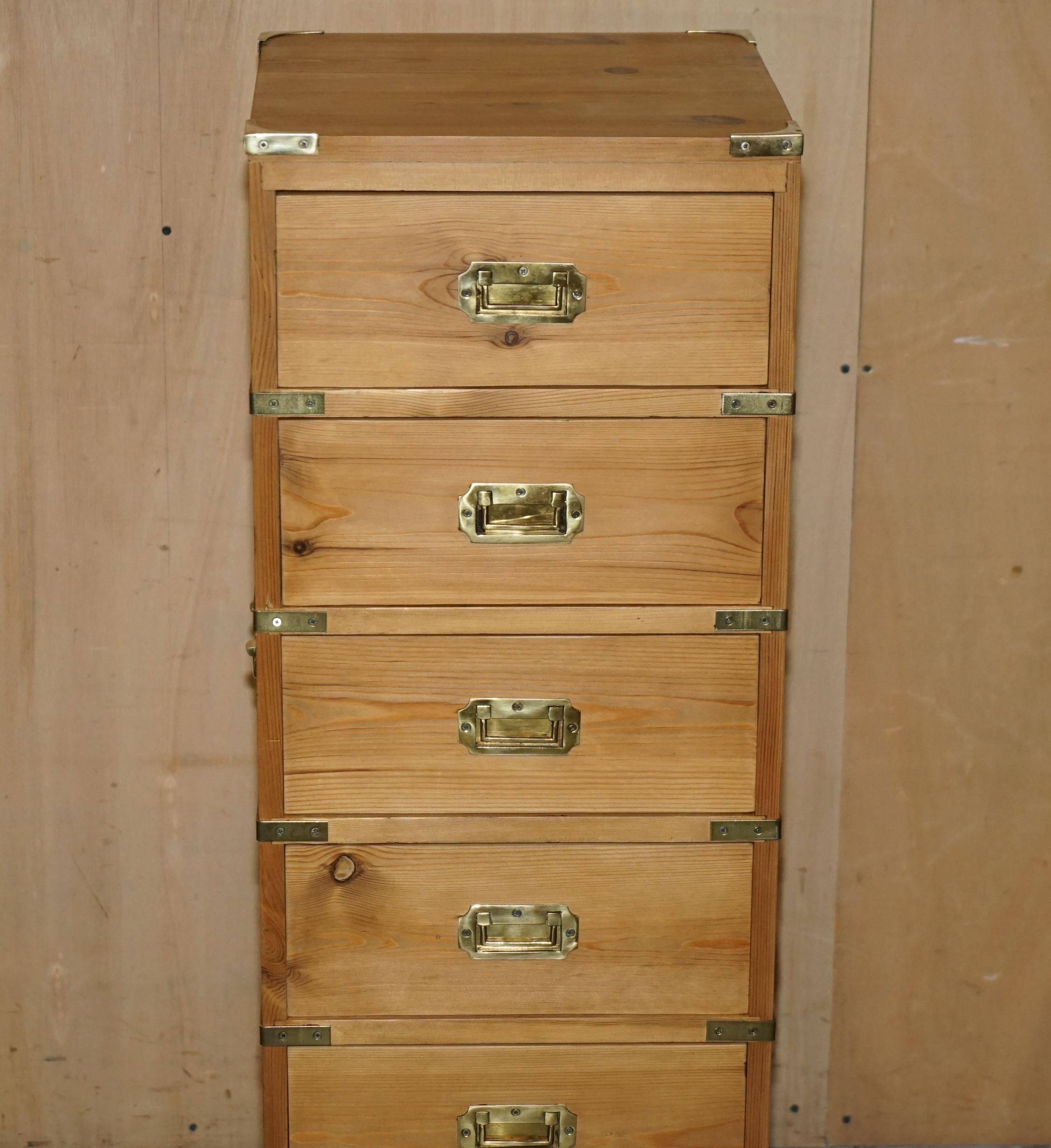 Restored vintage military high chest of drawers in English pine and brass.