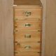 Restored vintage military high chest of drawers in English pine and brass.