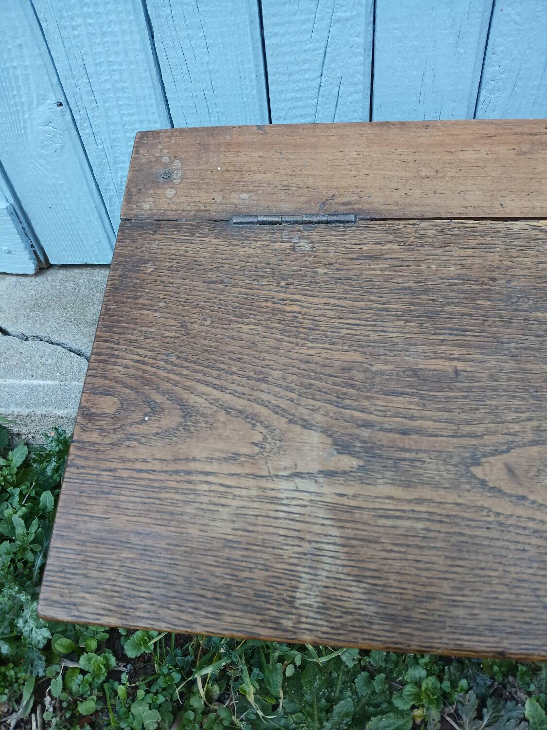 Small old wooden chest with hinged lid