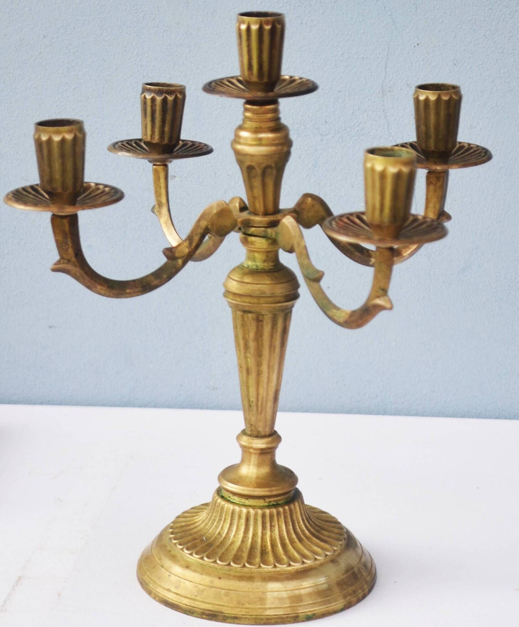 Solid brass candle holder with 5 candles and 4 arms