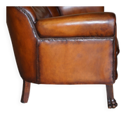 Victorian Chesterfield leather canapé with oak lion claw feet.
