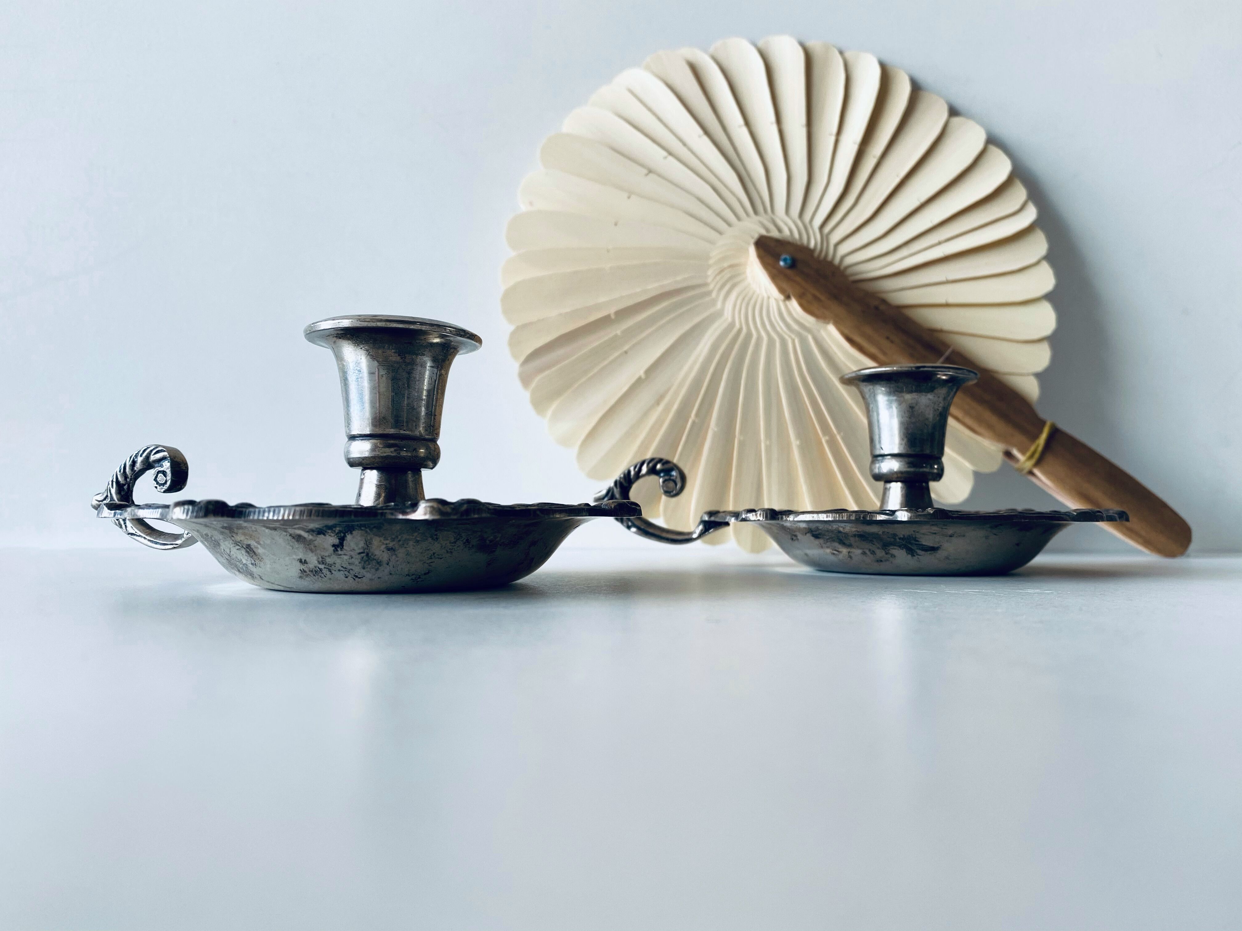 Pair of silver metal candlesticks
