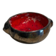 Deep red glazed and metallic ceramic catchall.