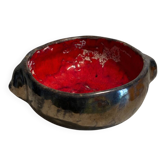 Deep red glazed and metallic ceramic catchall.