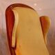 Fauteuil voltaire à oreilles, tissu jaune, XXe siècle