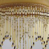 Vintage French amber mottled glass hanging ceiling light with beaded fringe.