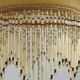 Vintage French amber mottled glass hanging ceiling light with beaded fringe.